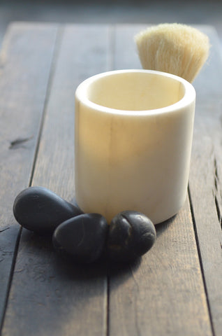 white marble brush vessel