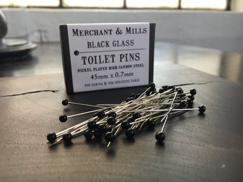 black glass toilet pins
